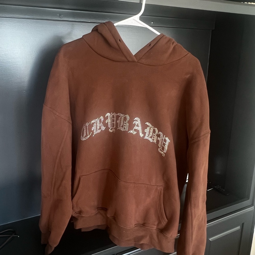Brown crybaby sweatshirt. Fits like a unisex xl.